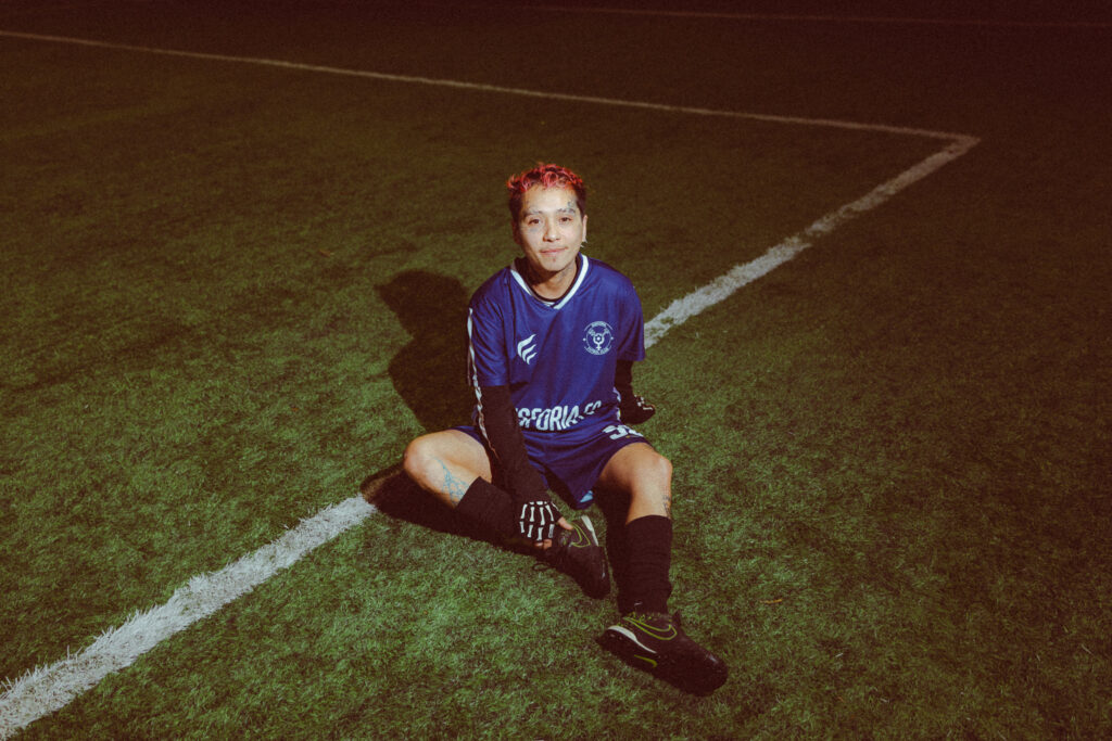Player portrait wearing Disforia FC jersey on the pitch