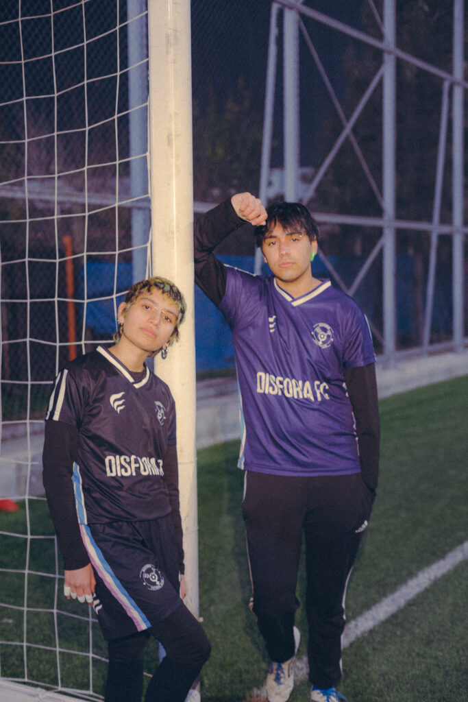 Two players posing by the goal