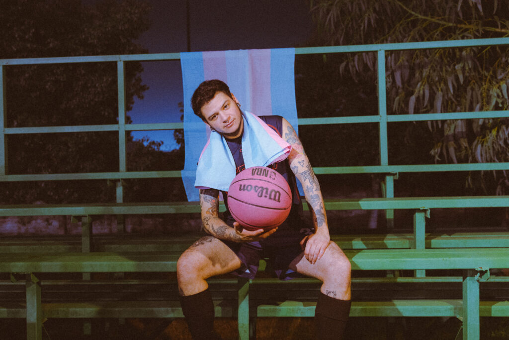 Portrait with basketball and trans flag