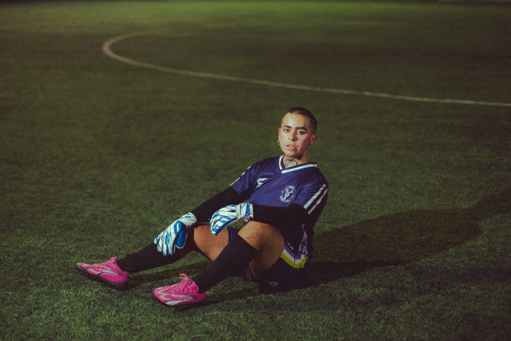 Goalkeeper sitting on the pitch